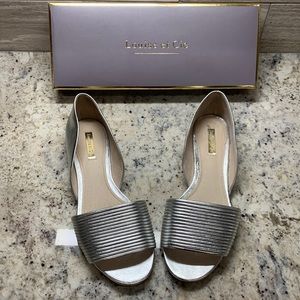 Gorgeous, block low-heel open-toed formal shoes in a metallic silver.